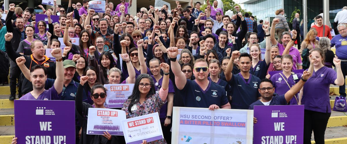 HSUWA Members stand together in a large group at a public sector pay rally.